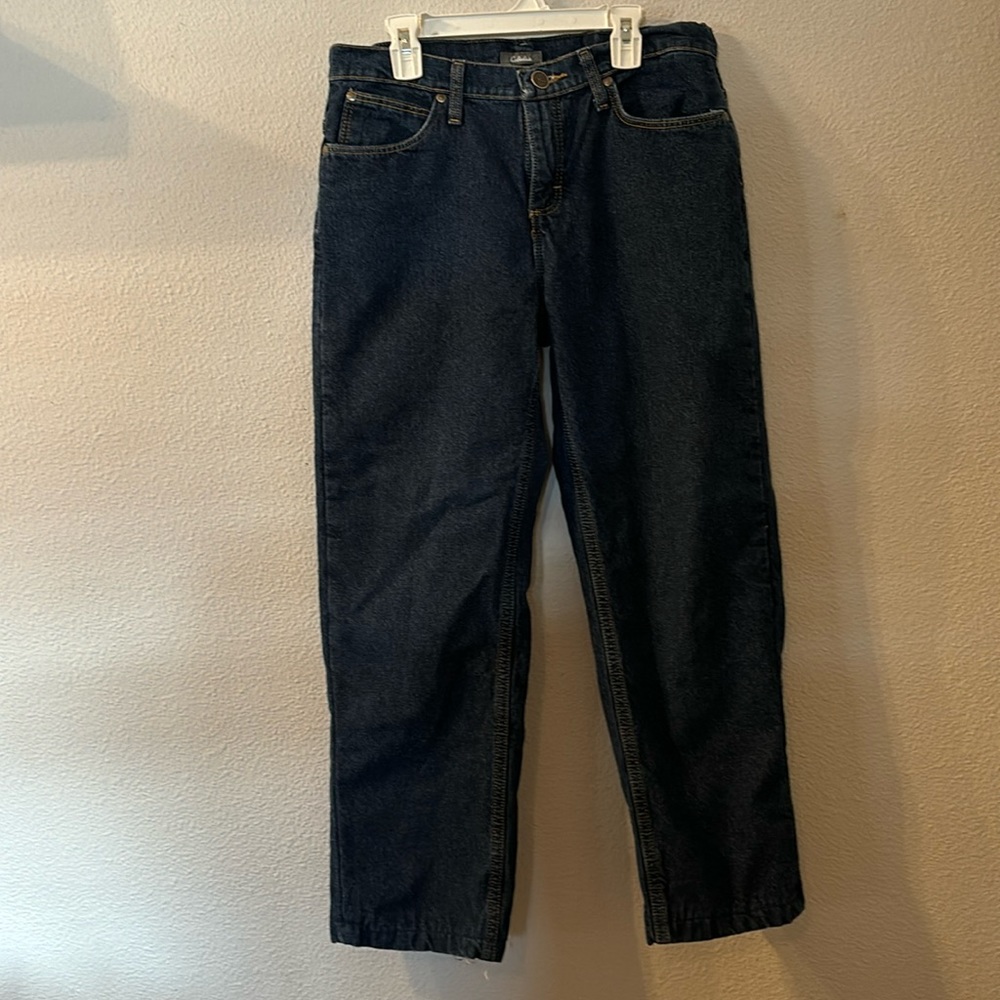 Cabela’s insulated jeans size is cut out waist is 16 inches inseam is 26 inches